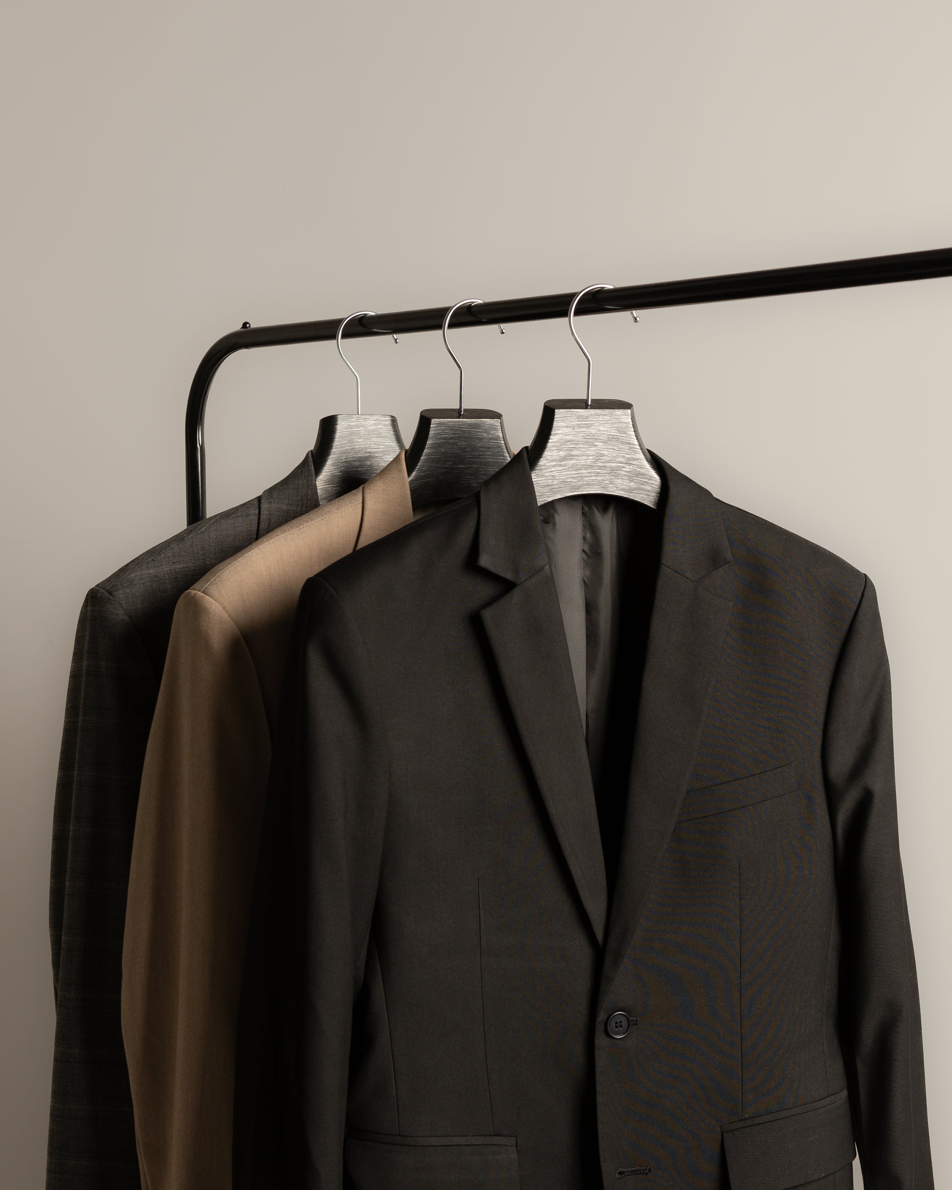 suits-on-rack-black-nineteen95